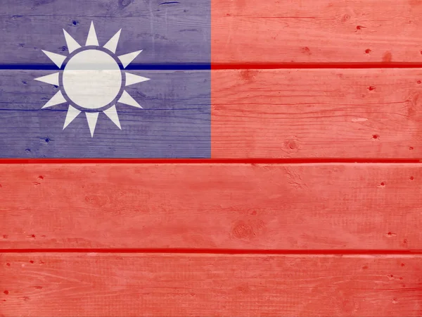 Taiwan flag painted on wood plank background. Brushed natural light knotted wooden board texture. Wooden texture background flag of Taiwan