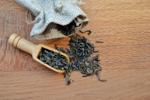 Jute Bag Leaf Tea Wooden Spoon Lies Wooden Background — Stock Photo, Image