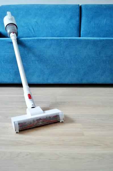 White Vacuum Cleaner Background Blue Sofa — Stock Photo, Image