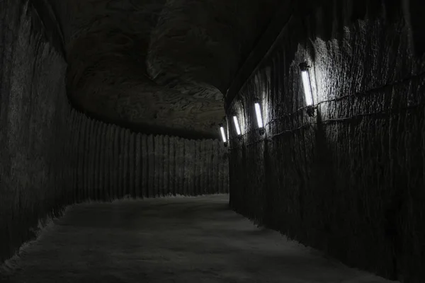 Dark Underground Corridor Tunnel Salt Mine Illuminated Dim Light Lamps — Stock Photo, Image