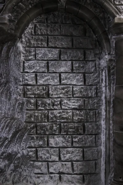 An old wall of rock salt in an old salt mine. Beautiful texture of bricks made of salt.