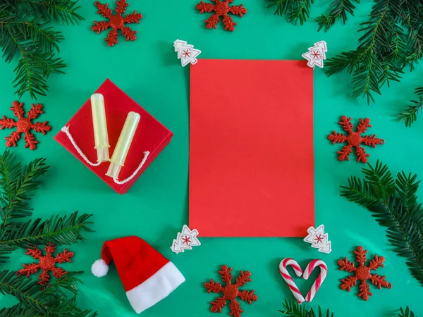 White shoes and christmas wreath.White female shoes on the left and a Christmas wreath from a Christmas tree with a place for text in the middle, top view close-up.