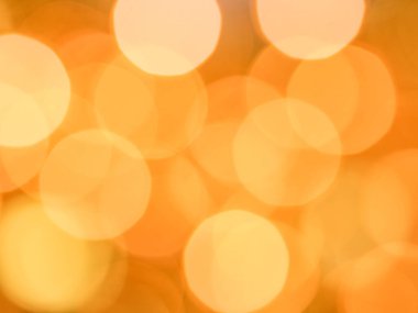 Büyük bokeh ışıkları olan altın soyut arkaplan, yakın plan.
