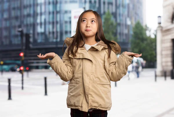 Chinese Little Girl Doubting Looking Upwards — Stock Photo, Image