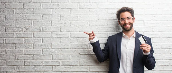 Young Business Man Wearing Suit White Bricks Wall Pointing Side — Stock Photo, Image