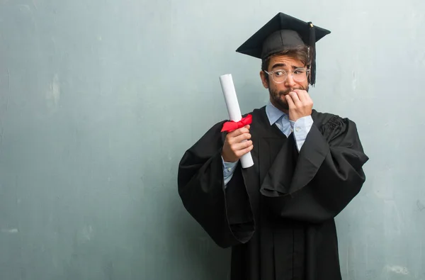 Young Graduated Man Grunge Wall Copy Space Biting Nails Nervous — Stock Photo, Image