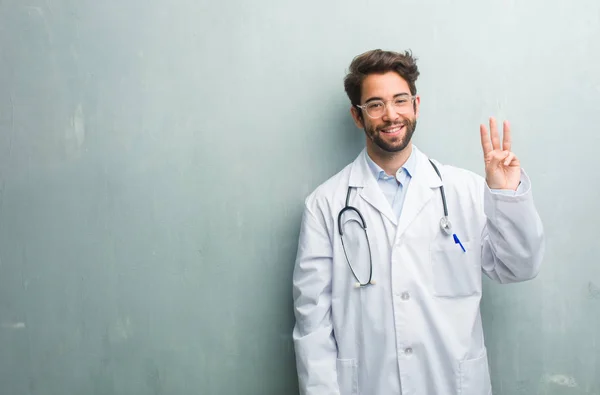 Young Friendly Doctor Man Grunge Wall Copy Space Showing Number — Stock Photo, Image