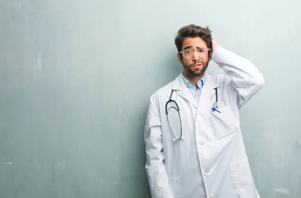 Young Friendly Doctor Man Grunge Wall Copy Space Worried Overwhelmed — Stock Photo, Image
