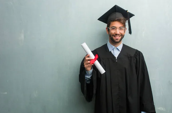 Young Graduated Man Grunge Wall Copy Space Cheerful Big Smile — Stock Photo, Image