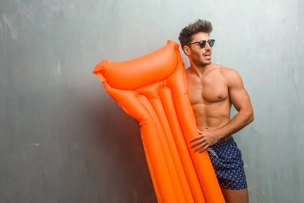 Young Athletic Man Wearing Swimsuit Grunge Wall Very Scared Afraid — Stock Photo, Image