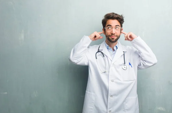 Young Friendly Doctor Man Grunge Wall Copy Space Covering Ears — Stock Photo, Image