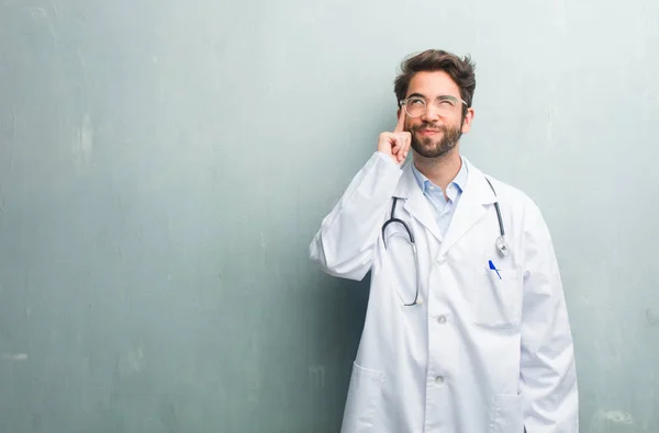 Young Friendly Doctor Man Grunge Wall Copy Space Thinking Looking — Stock Photo, Image