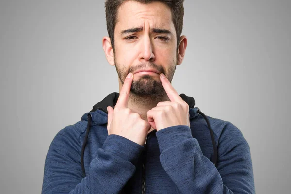 Young Man Pointing His Mouth Grey Background — Stock Photo, Image