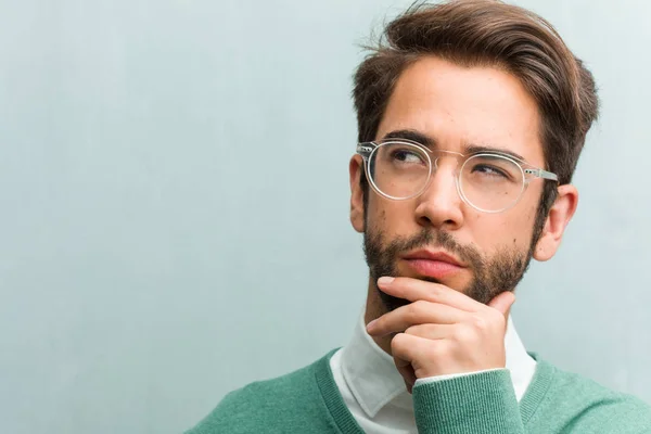 Young Handsome Entrepreneur Man Face Closeup Doubting Confused Thinking Idea — Stock Photo, Image
