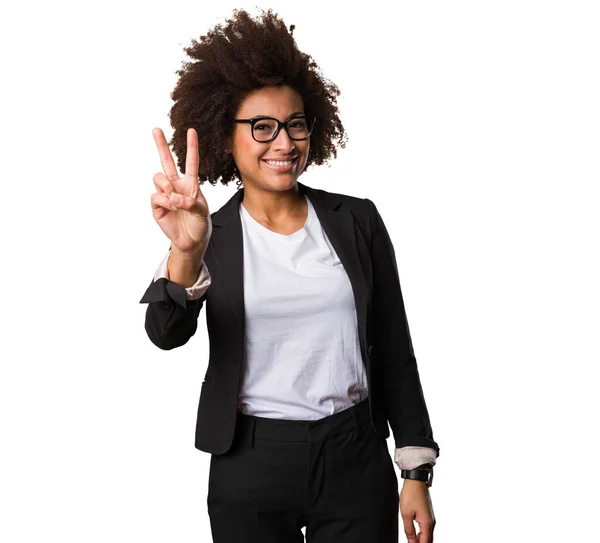 business black woman doing victory gesture