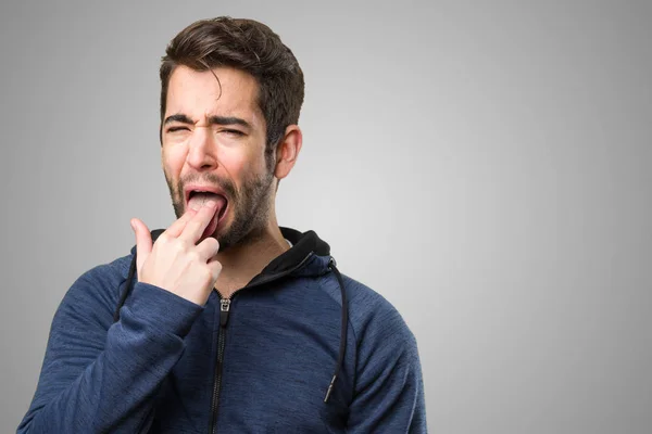 Young Man Doing Vomit Gesture Grey Background — Stock Photo, Image