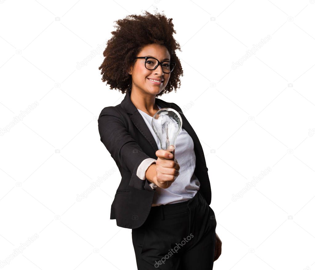 business black woman holding lightbulb