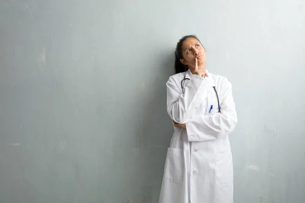 Young Indian Doctor Woman Wall Thinking Looking Confused Idea Would — Stock Photo, Image