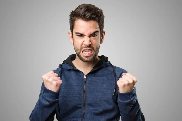 Young Man Doing Winner Gesture Grey Background — Stock Photo, Image