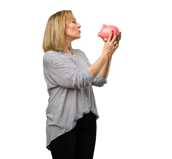 Blonde Mature Woman Kissing Her Piggy Bank — Stock Photo, Image