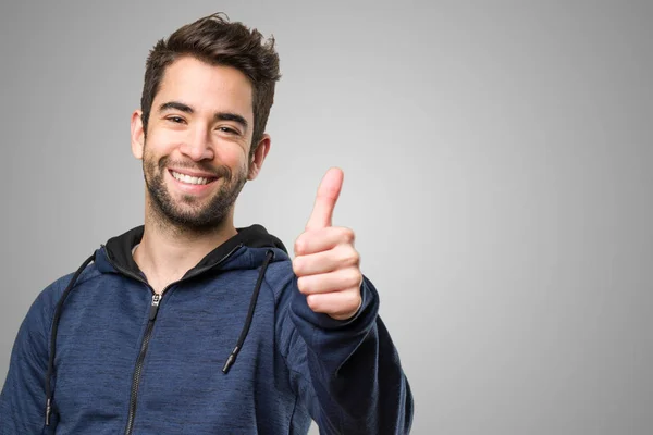 Young Man Doing Okay Gesture Grey Background — Stock Photo, Image
