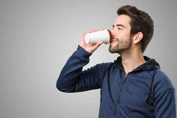 Young Man Drinking Coffee Grey Background — Stock Photo, Image