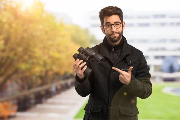 Young Man Holding Binoculars — Stock Photo, Image