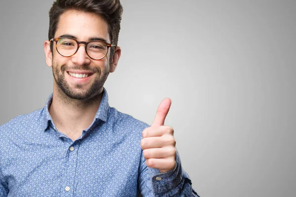 Young Man Doing Okay Gesture Grey Background — Stock Photo, Image