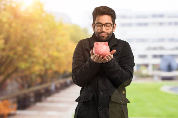 Mladý Muž Který Držel Piggie Banky — Stock fotografie