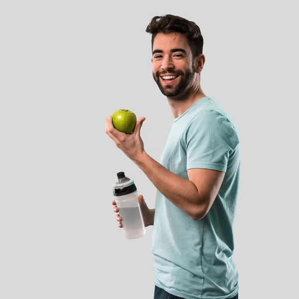 Jeune Homme Sportif Tenant Une Bouteille Une Pomme — Photo