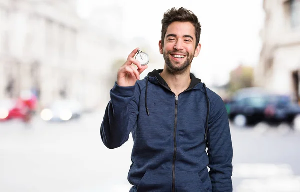 Young Man Holding Stopwatch Blurred Background — Stock Photo, Image