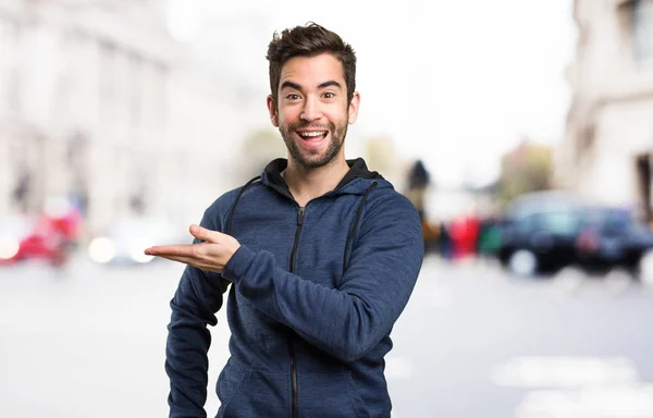 Joven Señalando Espacio Sobre Fondo Borroso — Foto de Stock