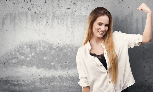 Pretty Young Woman Doing Strong Gesture Grunge Grey Background — Stock Photo, Image