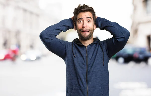 afraid young man on blurred background