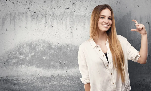 Pretty Young Woman Doing Size Gesture Grunge Grey Background — Stock Photo, Image