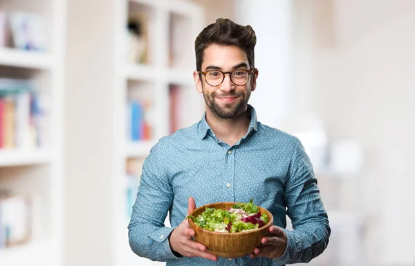 Young Man Holding Salad Blurred Background — Stock Photo, Image