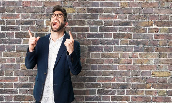 Young Man Doing Winner Gesture Brick Wall — Stock Photo, Image