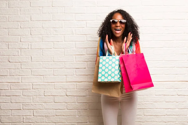 Young Black Woman Shopping Bags Laughing Having Fun Brick Wall — Stock Photo, Image