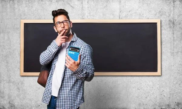 Estudiante Hombre Sosteniendo Una Calculadora — Foto de Stock