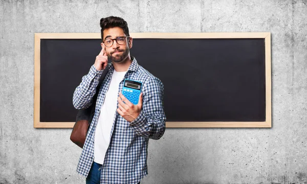 Student Człowiek Posiadający Kalkulator — Zdjęcie stockowe