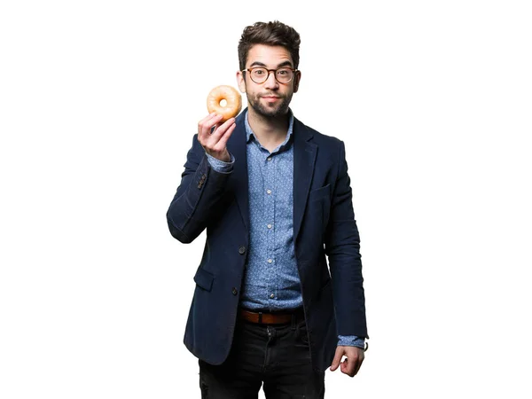 Νέος Άνθρωπος Που Κρατά Ένα Ντόνατ Που Απομονώνονται Λευκό Φόντο — Φωτογραφία Αρχείου