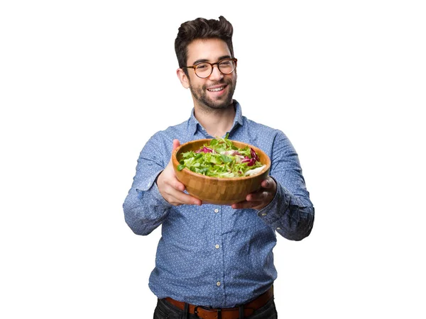 Joven Ofreciendo Ensalada Aislada Sobre Fondo Blanco — Foto de Stock