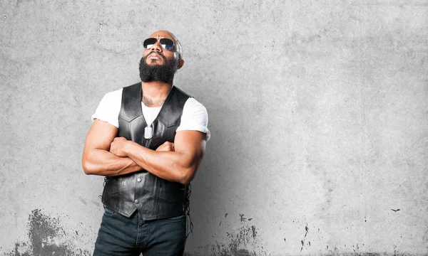 black man thinking on grey background