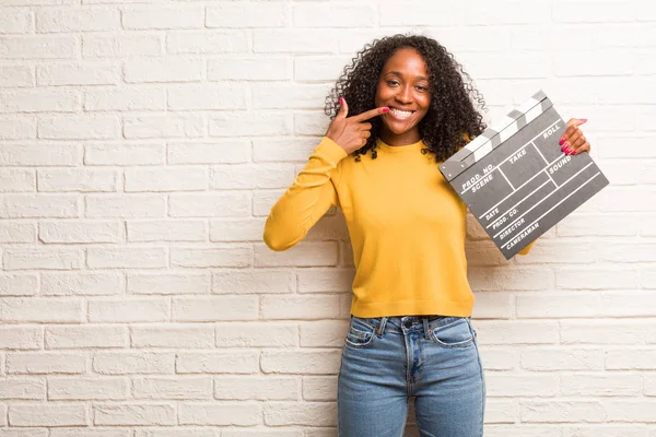 Young Black Woman Clapboard Smiles Pointing Mouth Concept Perfect Teeth — Stock Photo, Image