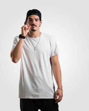 Young rapper man keeping a secret or asking for silence, serious face, obedience concept clipart