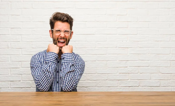 Young Caucasian Man Sitting Very Happy Excited Raising Arms Celebrating — Stock Photo, Image