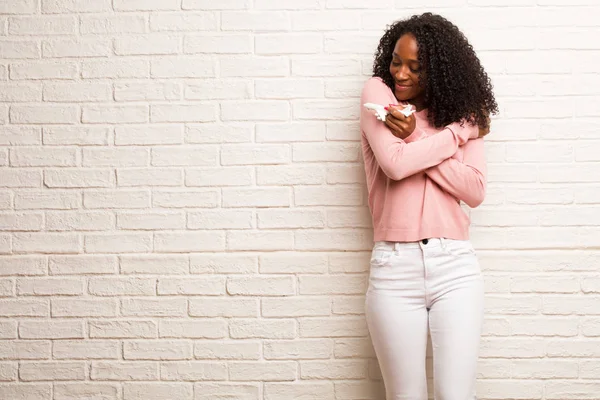 Young Black Woman Airplane Model Happy Giving Herself Hug Brick — Stock Photo, Image