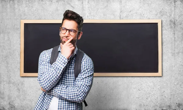 Student Man Denken Grijze Achtergrond — Stockfoto