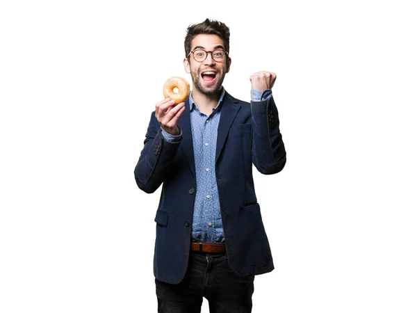 Joven Sosteniendo Donut Haciendo Gesto Ganador Aislado Sobre Fondo Blanco —  Fotos de Stock