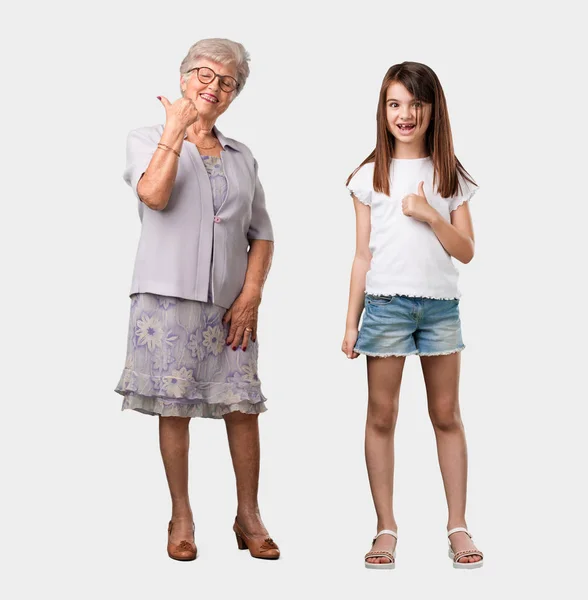 Full Body Elderly Lady Her Granddaughter Cheerful Excited Smiling Raising — Stock Photo, Image